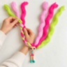 Păpușică surpriză Candylocks cu păr lung pentru coafuri